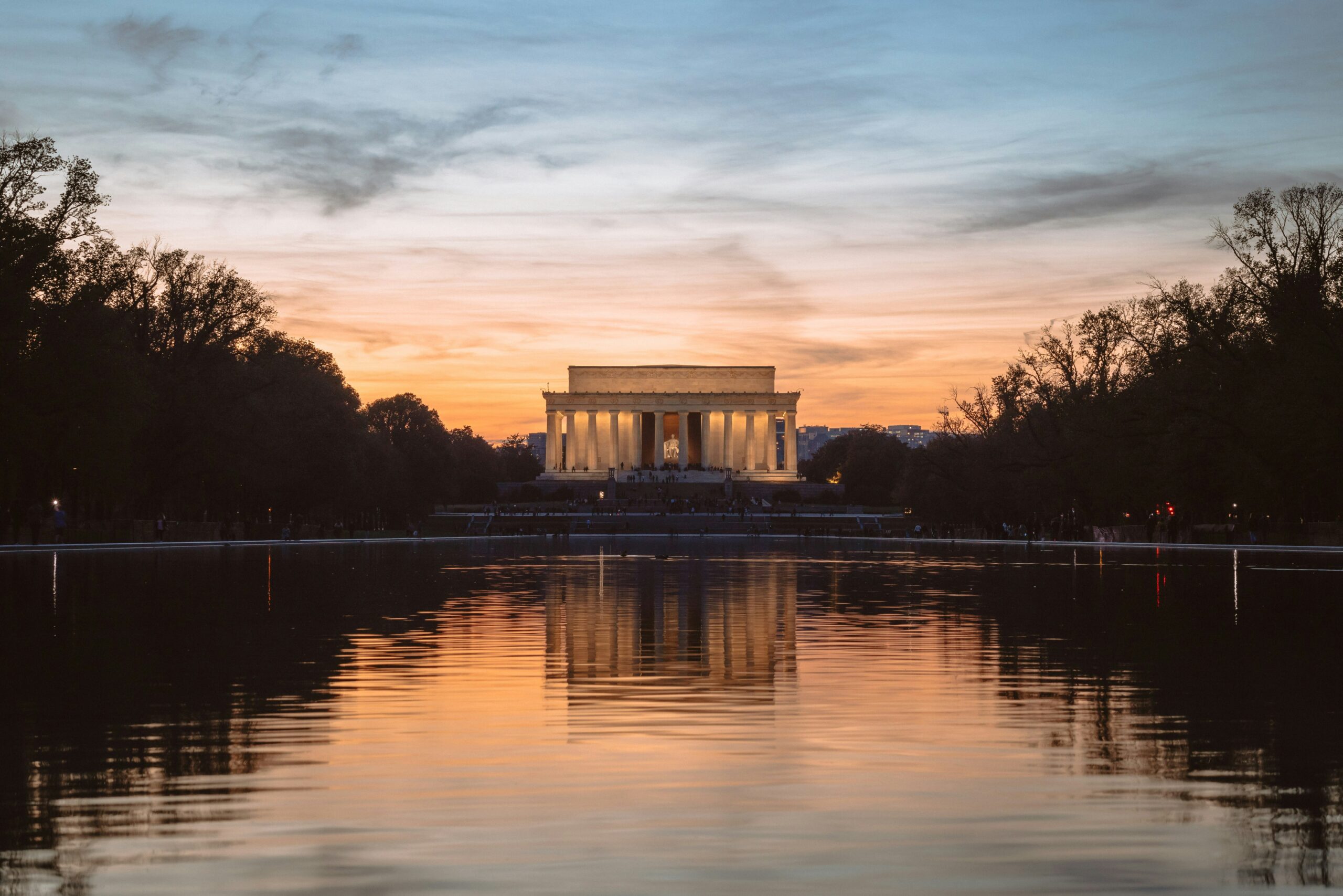 The lincoln memorial across the tidal basin at sunset